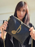 POCHETTE IN SIMILPELLE E NOTA MUSICALE RICAMATA